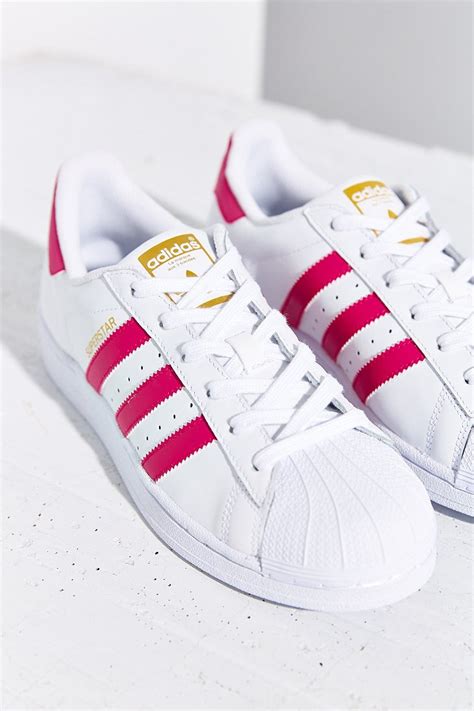 adidas stripe sneakers|Adidas shoes with pink stripes.